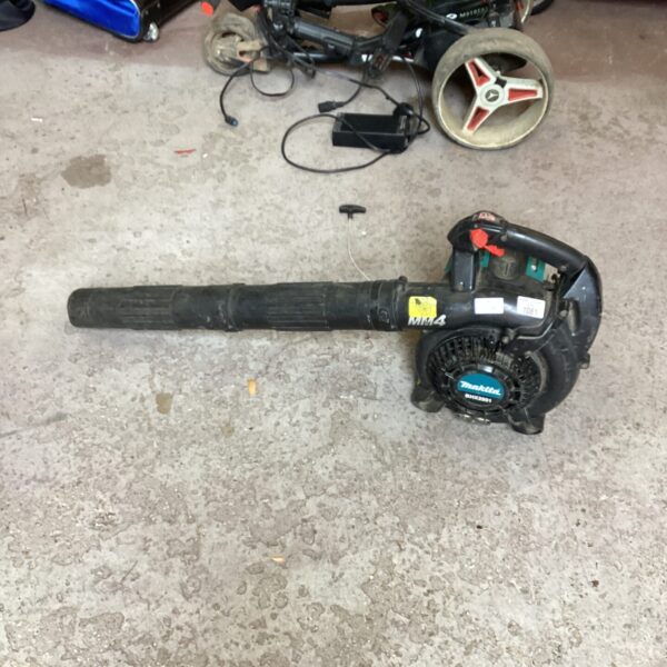 Makita petrol leaf blower in need of repair for garden maintenance.