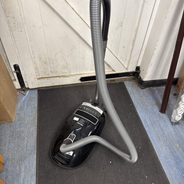 Miele C3 Extreme Powerlite cylinder vacuum cleaner for home cleaning.