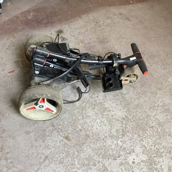 Electric golf trolley by Motocaddy needing repair for parts or restoration.