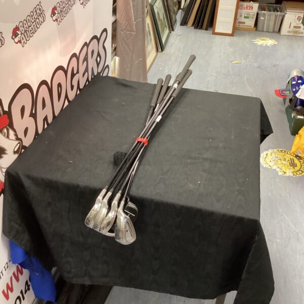 Vintage Black Cat Cougar ladies golf club set on display.