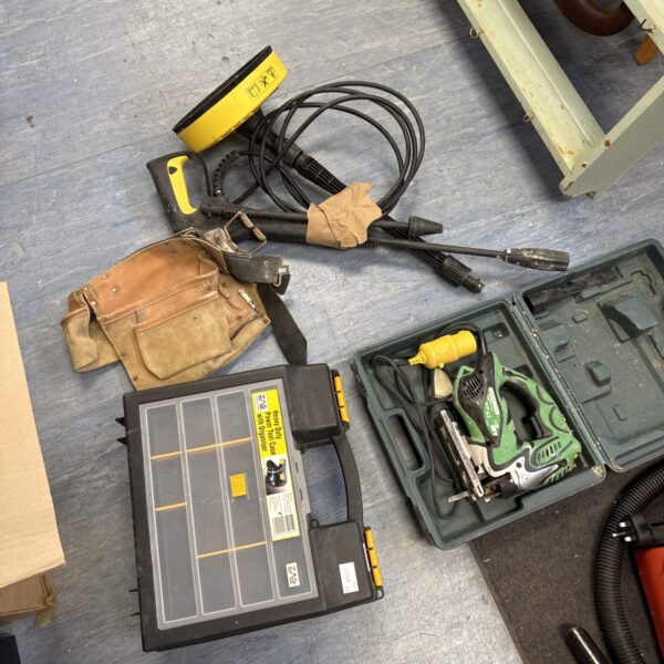 Tool bundle including a Hitachi jigsaw and Karcher attachments.