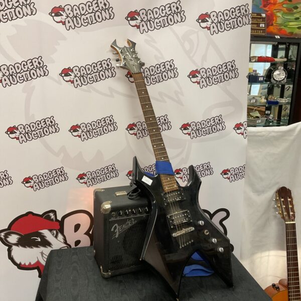 B C Rich Warlock electric guitar with Fender amplifier combo.