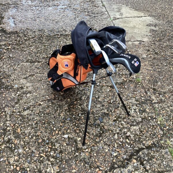 Child's golf club set with bag, ideal for young beginners.