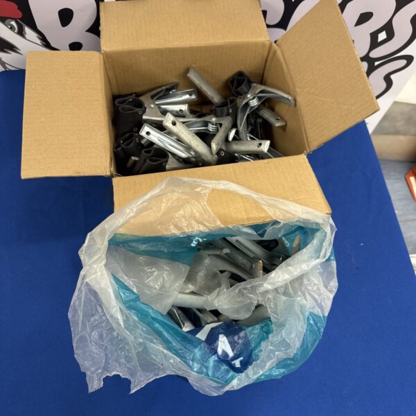 A box filled with metal canopy clips for outdoor use.