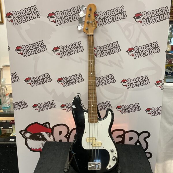 Black Encore bass guitar, vintage electric instrument.