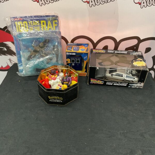 Mixed toy lot including Back to the Future DeLorean and Match Attax cards.