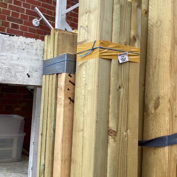 Strapped bundles of timber ready for construction or DIY projects.