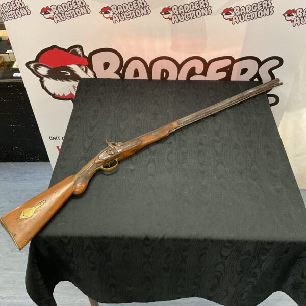 Antique percussion cap musket, a vintage British or Indian army rifle.