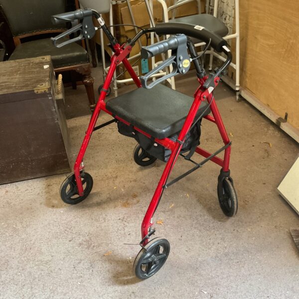 Red Drive mobility walker with a padded seat and wire basket.