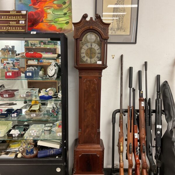 Jn Draper London grandmother clock in a shop setting.