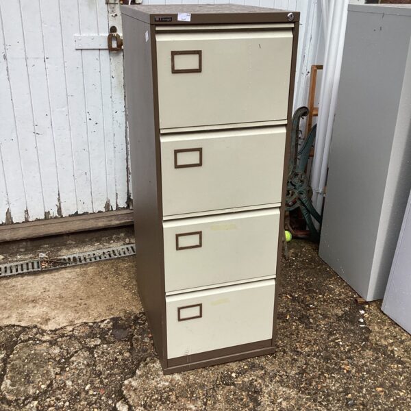 Beige vintage Triumph filing cabinet with four drawers.