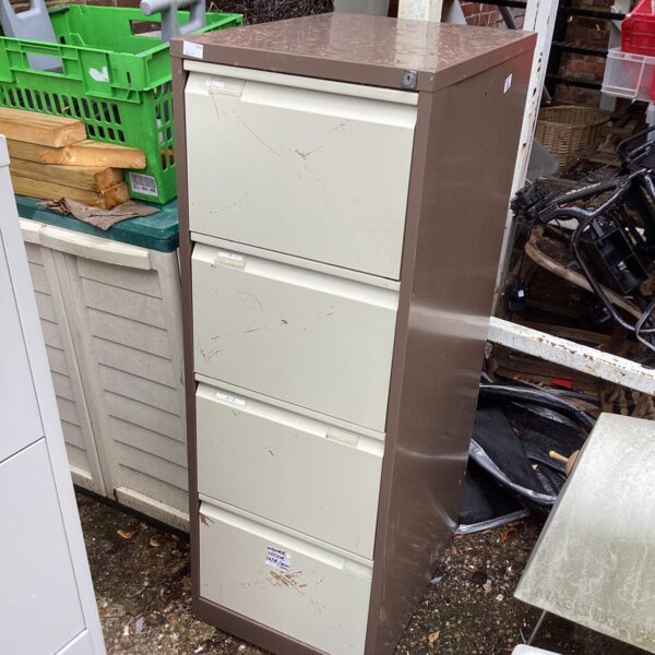 Vintage metal filing cabinet with four drawers for office storage.