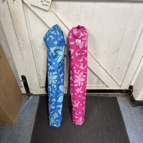 Pair of patterned folding camping chairs for outdoor use.