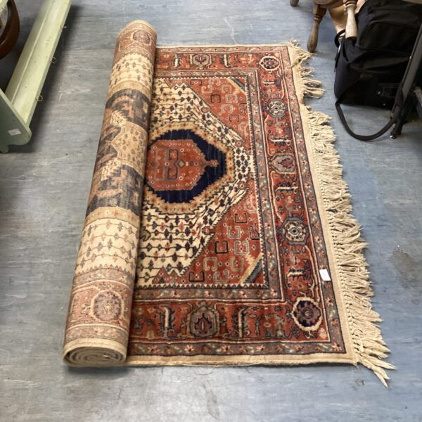 Intricate floral design on a vintage Persian rug.