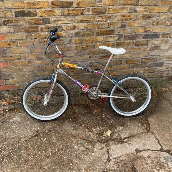 Vibrant orange vintage BMX bike, a collectible retro bicycle.