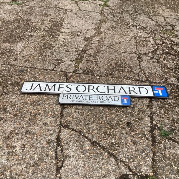 Vintage James Orchard street sign with enamel paint and wear.