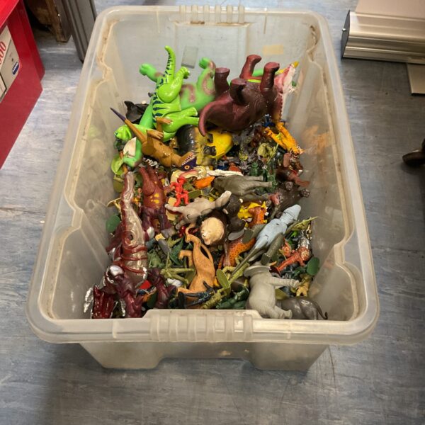 Overview of a large lot of vintage animal and soldier toys.