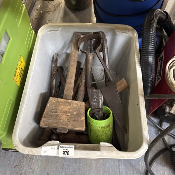 A box of assorted vintage hand tools including a wooden mallet.