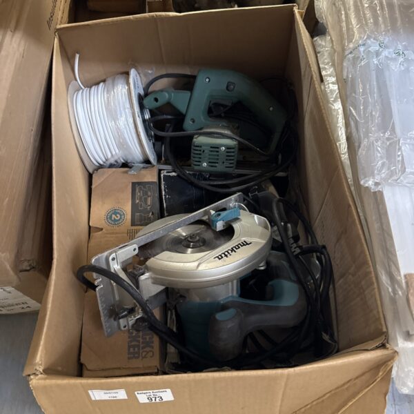 Makita circular saw in a box of shed clearance items.