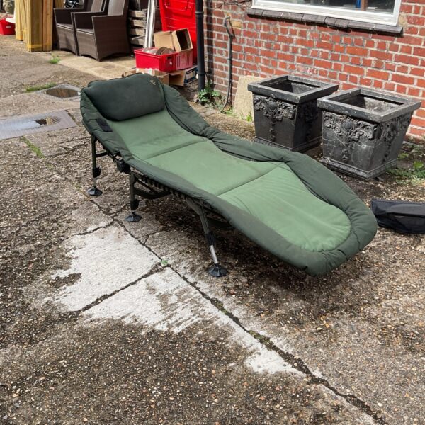 Used Nash Indulgence 3 fishing bed chair for angling sessions.
