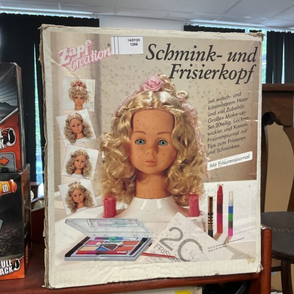 Vintage Zapf Creation hair dressing head model 1266 for styling.