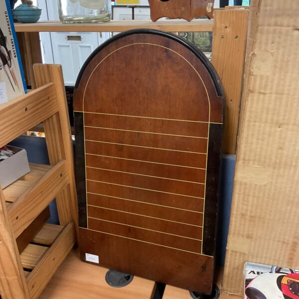 Vintage shove ha’penny board with wooden playing surface.