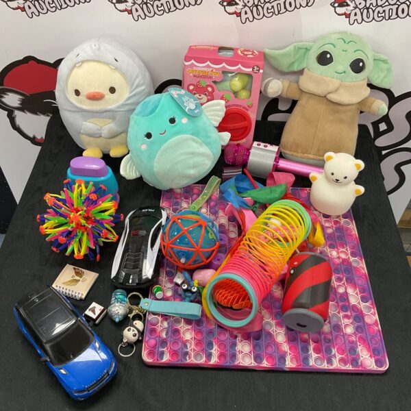 Colourful mixed toy lot with soft toys and fidgets.