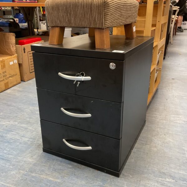 Small lockable office filing cabinet with three drawers.