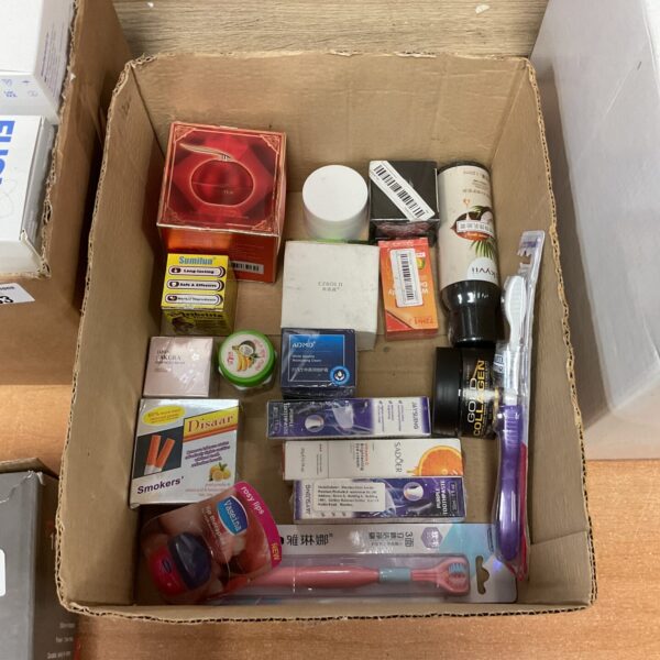 Assorted cosmetic and toiletries lot with various beauty products.