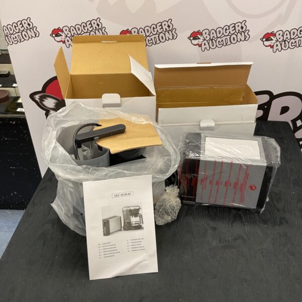 New coffee machine and toaster set in original packaging.