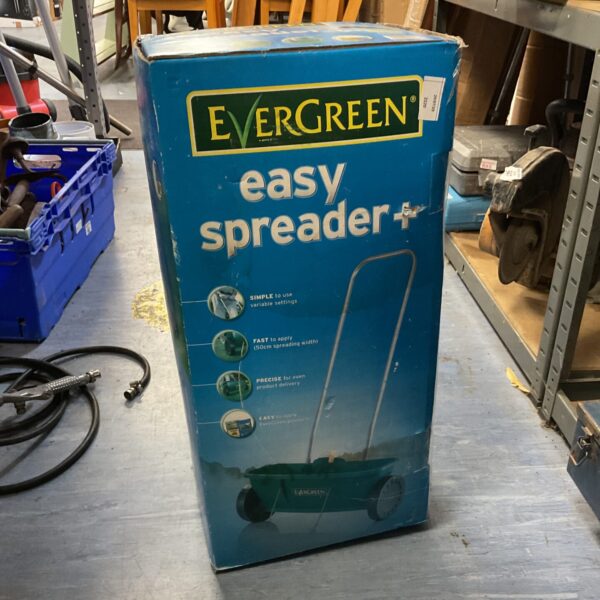 Vintage Evergreen seed spreader for garden seed distribution.