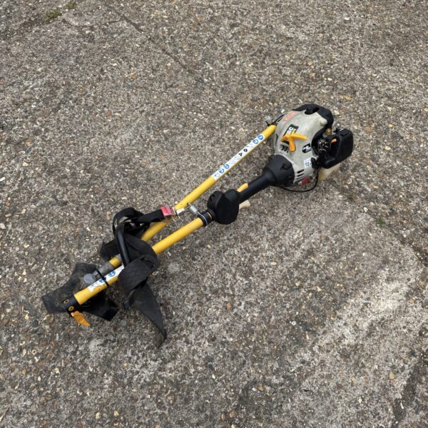 Ryobi 3046ye petrol strimmer for garden maintenance and landscaping.