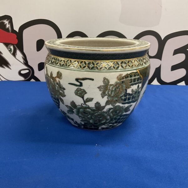 Vintage Chinese fish bowl with goldfish design, side view.