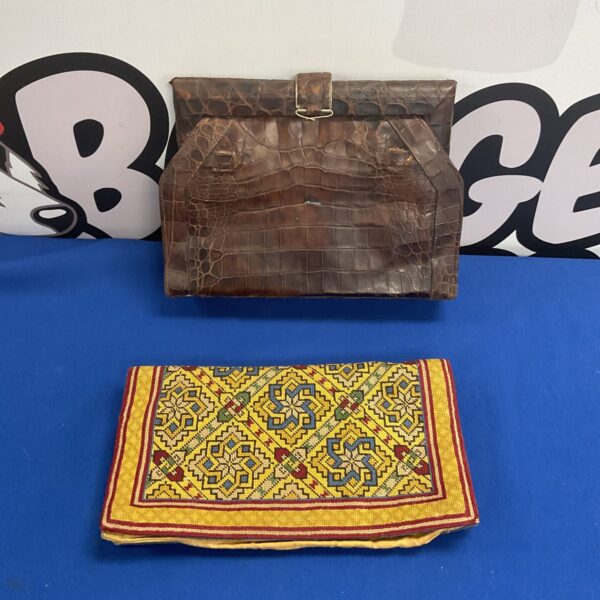 Brown crocodile skin vintage handbag with top handle.