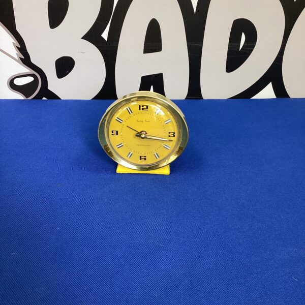 Vintage Westclock Baby Ben alarm clock with a white face and black numbers.