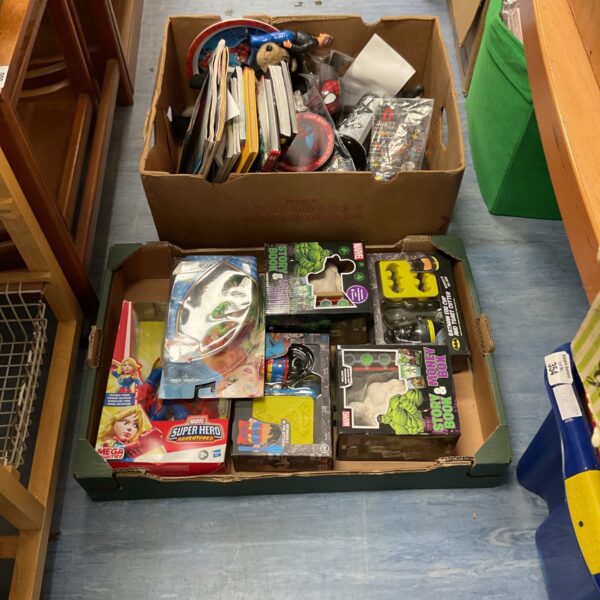 Mixed lot of superhero merchandise including Marvel and DC collectibles.