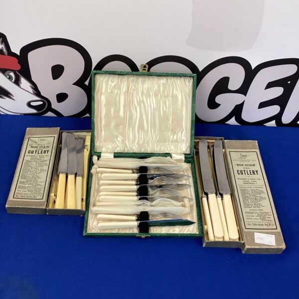 Vintage W&H cutlery set with bone handles in original box.