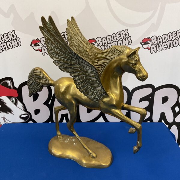 Detailed brass Pegasus sculpture, a mythical creature figurine.