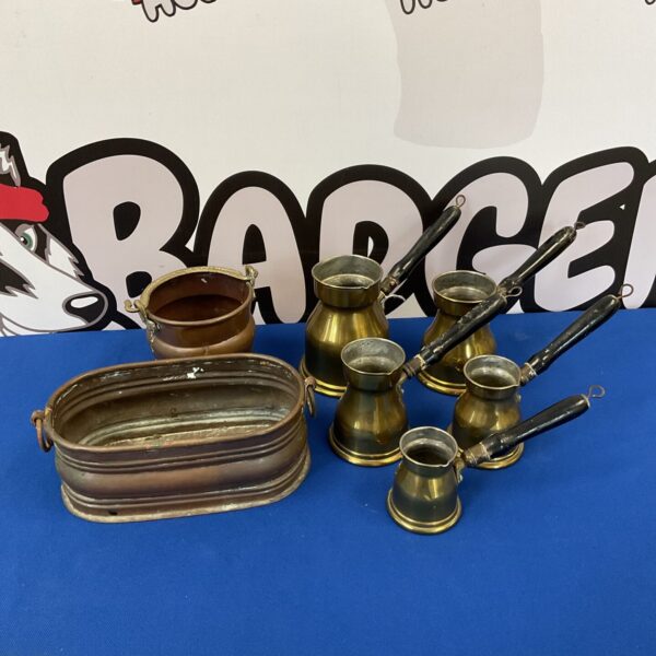 Vintage brass and copper measures set for kitchen use.