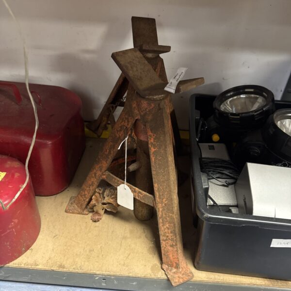 Pair of vintage metal axle stands for vehicle maintenance.