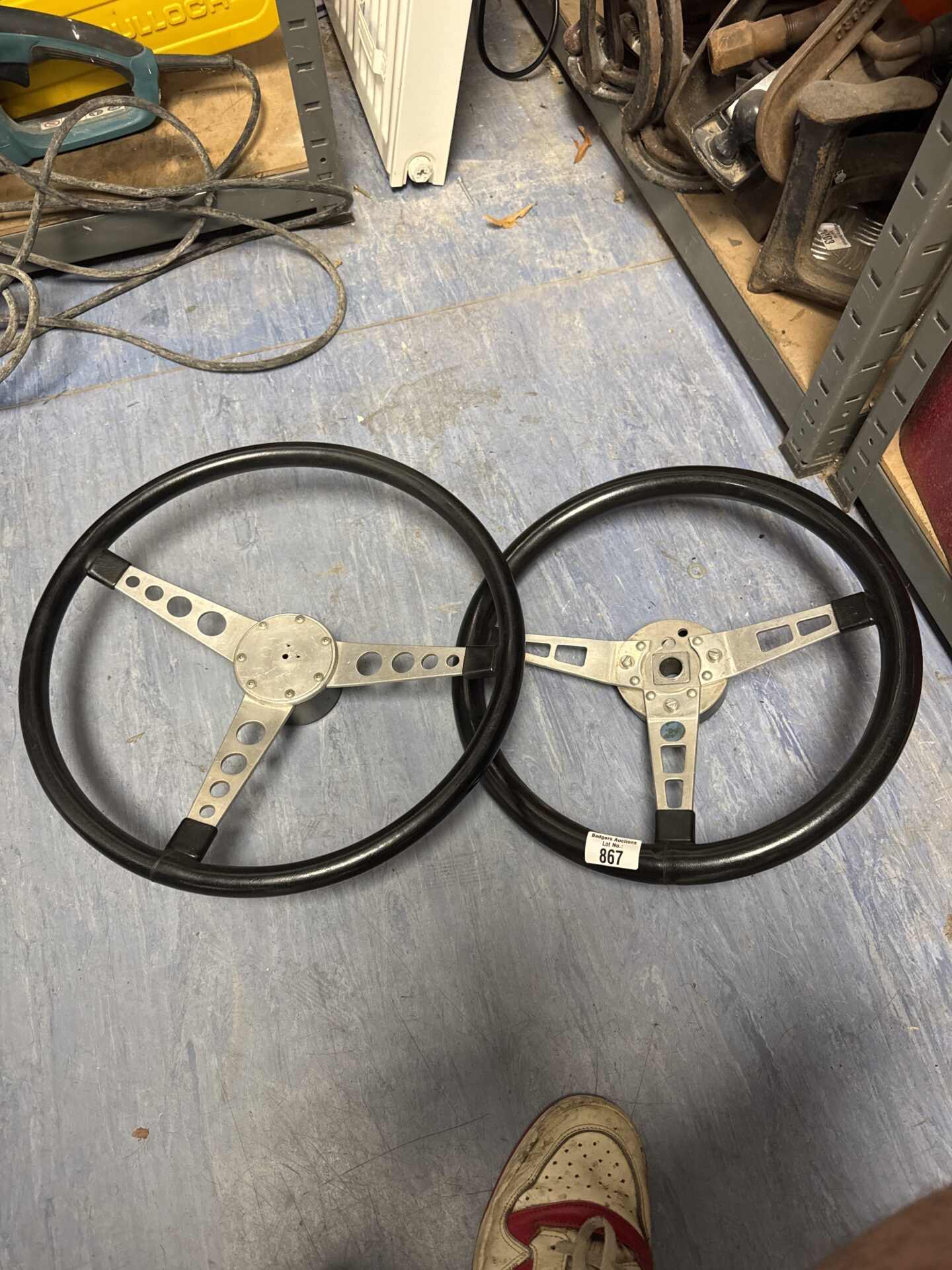 867 Two vintage MG steering wheels