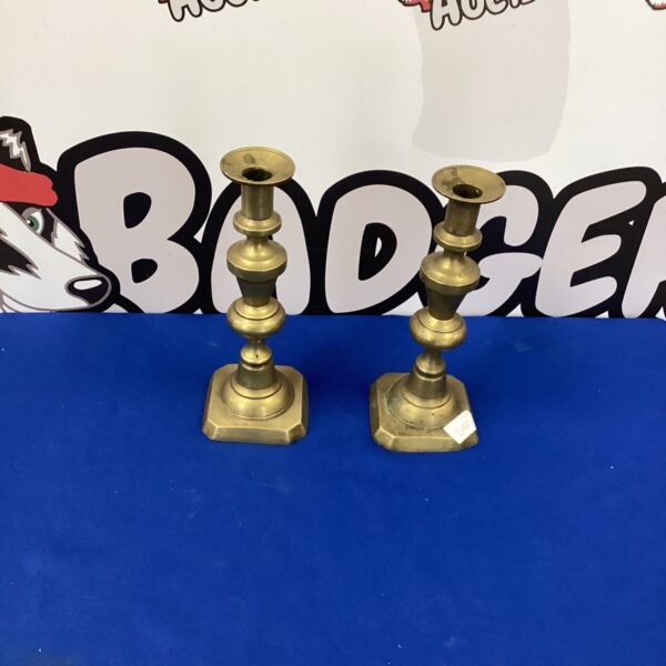 Pair of vintage brass candlesticks for home decor.