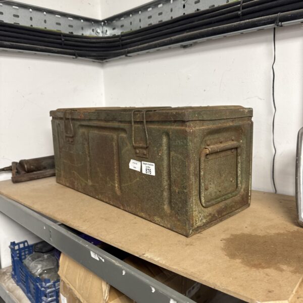 Weathered vintage metal ammo crate for storage and display.