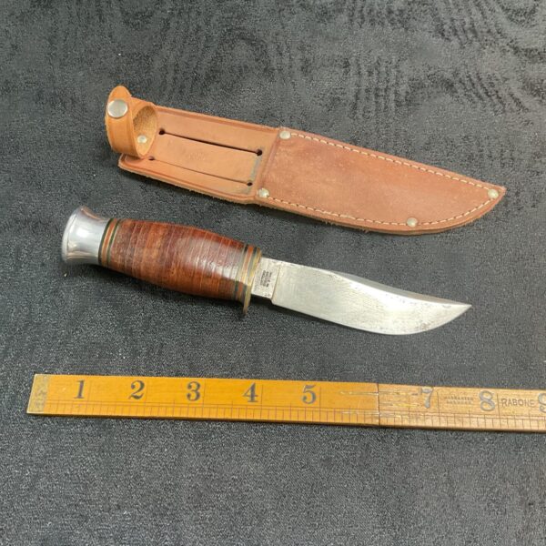 Vintage Milbro Kampa knife with leather sheath, classic Sheffield cutlery.