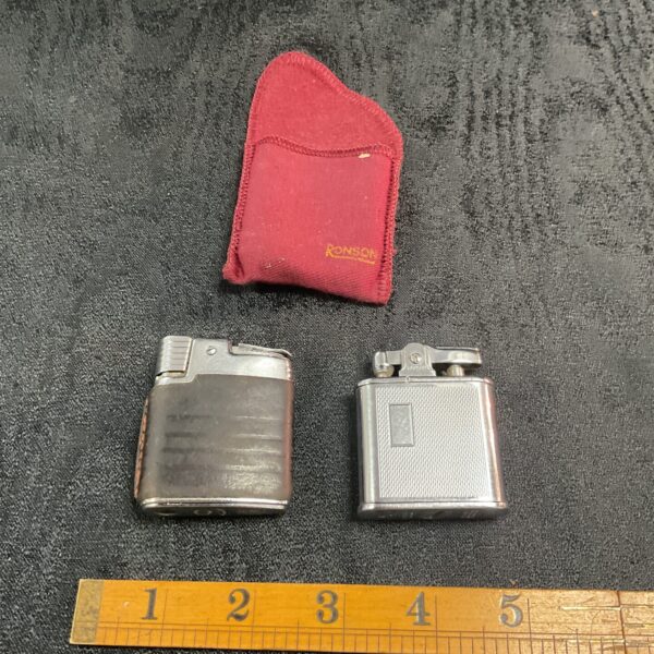 Vintage Ronson cigarette lighters in a lot, collectible metal design.