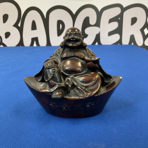 Detailed hand-carved soapstone Happy Buddha statue for display.