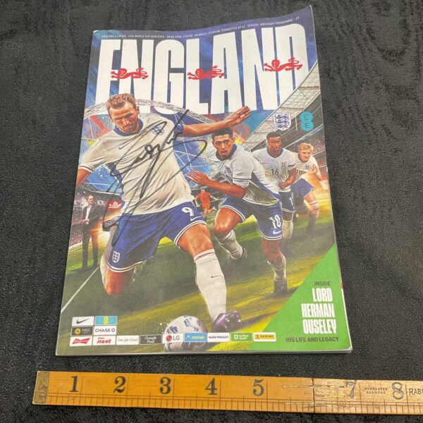 Signed England football program featuring Gary Cahill's autograph.