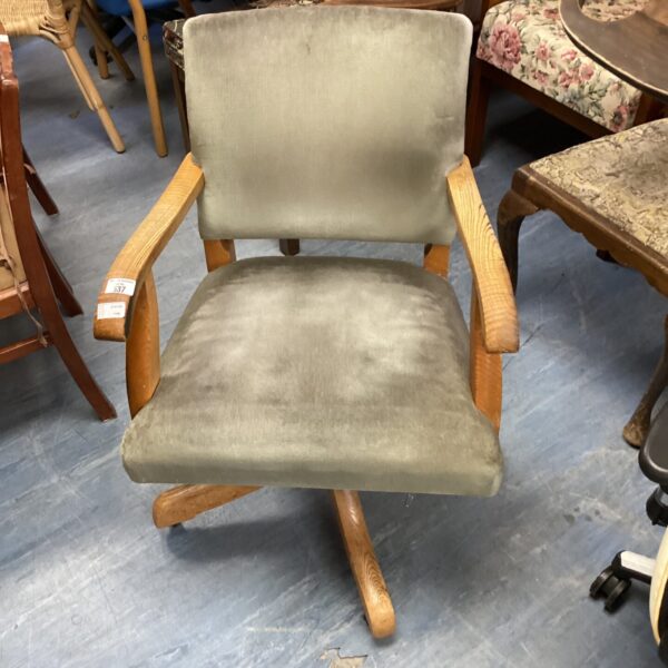 Vintage Hillcrest captain’s armchair with swivel base.