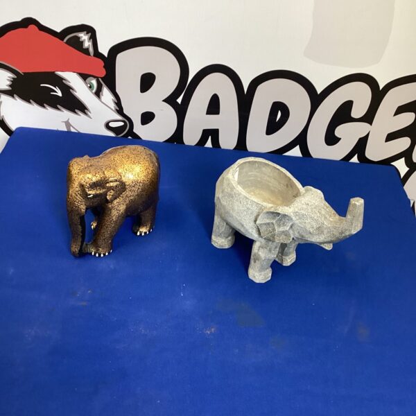 Pair of vintage brass elephant ornaments for home decor.