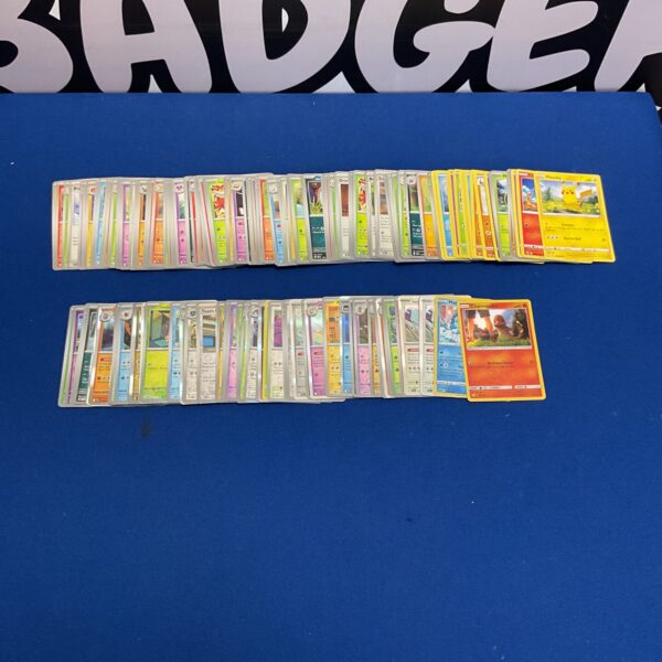 Pokemon card lot with holographic cards for collectors.